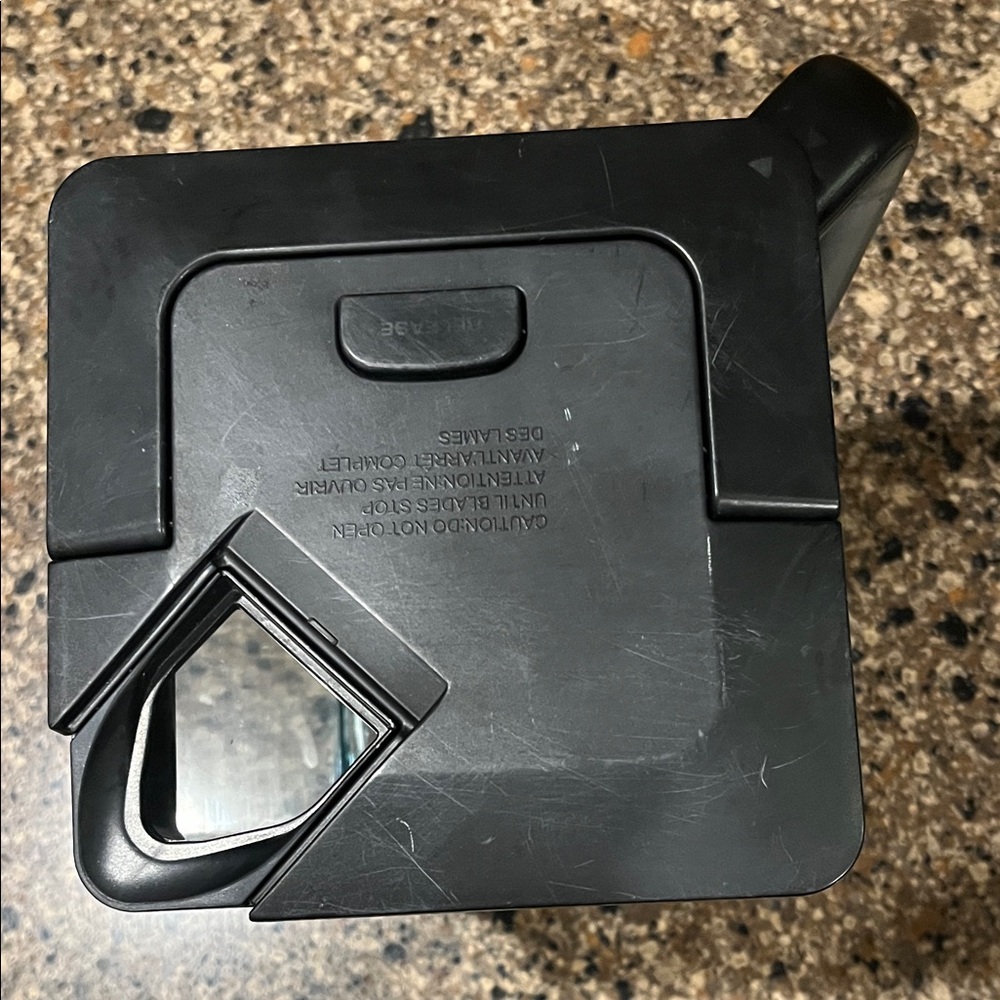 Ninja blender pitcher with mixing blade and lid.